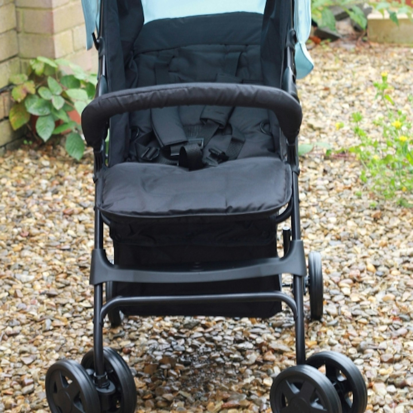 seat and wheels of the Hauck Lightweight Sport Pushchair outside