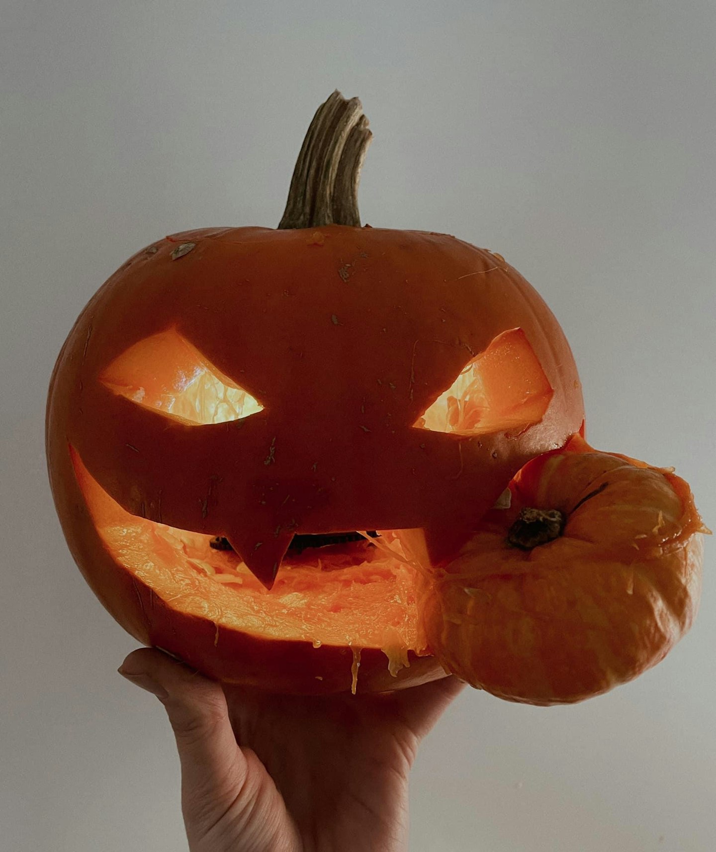 Scary lit-up Halloween carved pumpkin