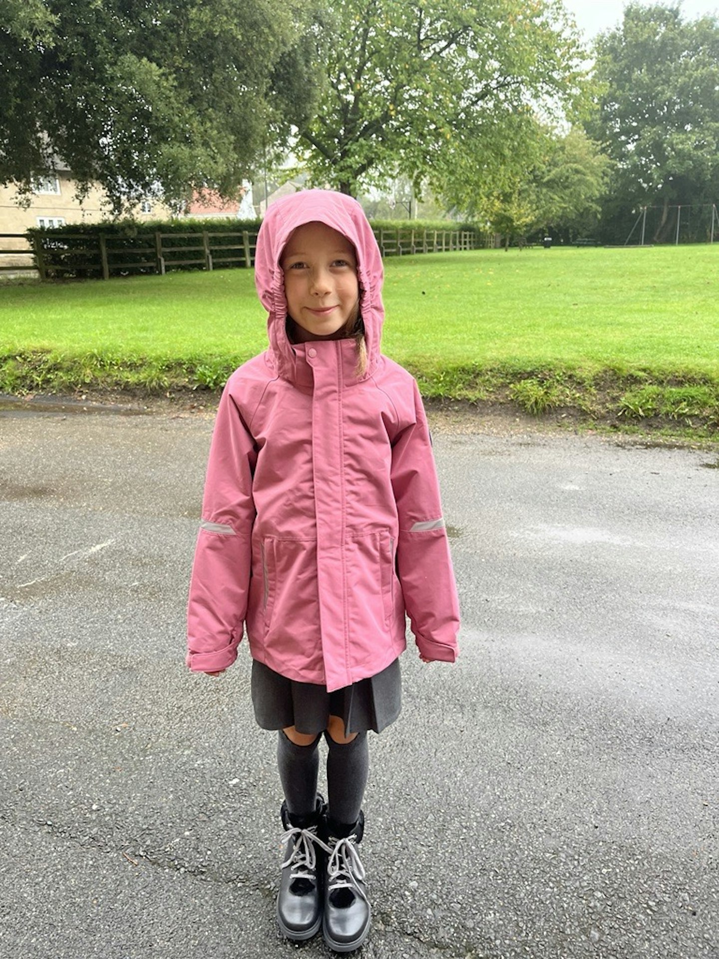 A front view of a child wearing the PO.P Waterproof School Coat