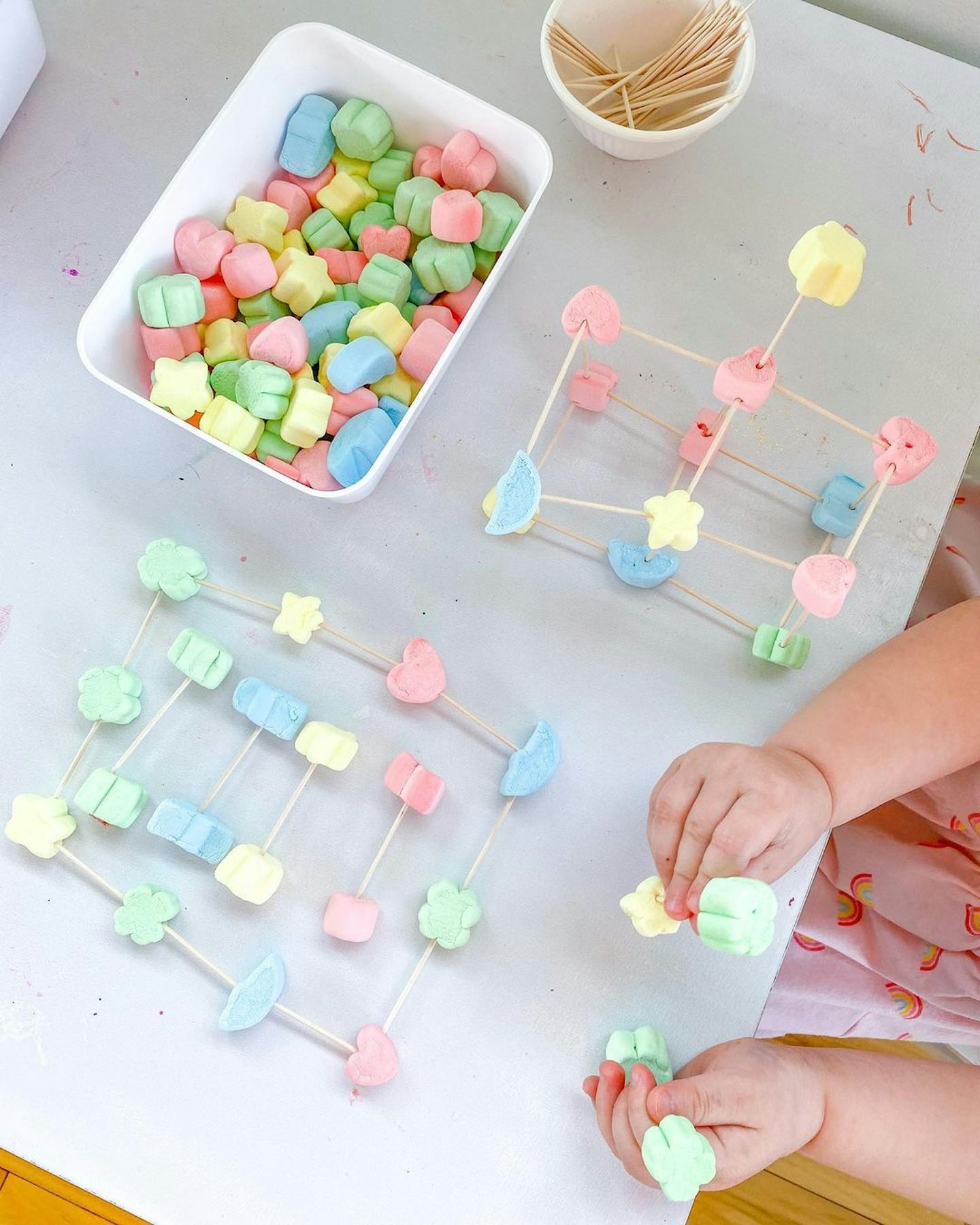 child making marshmallow structures as a fun sensory game