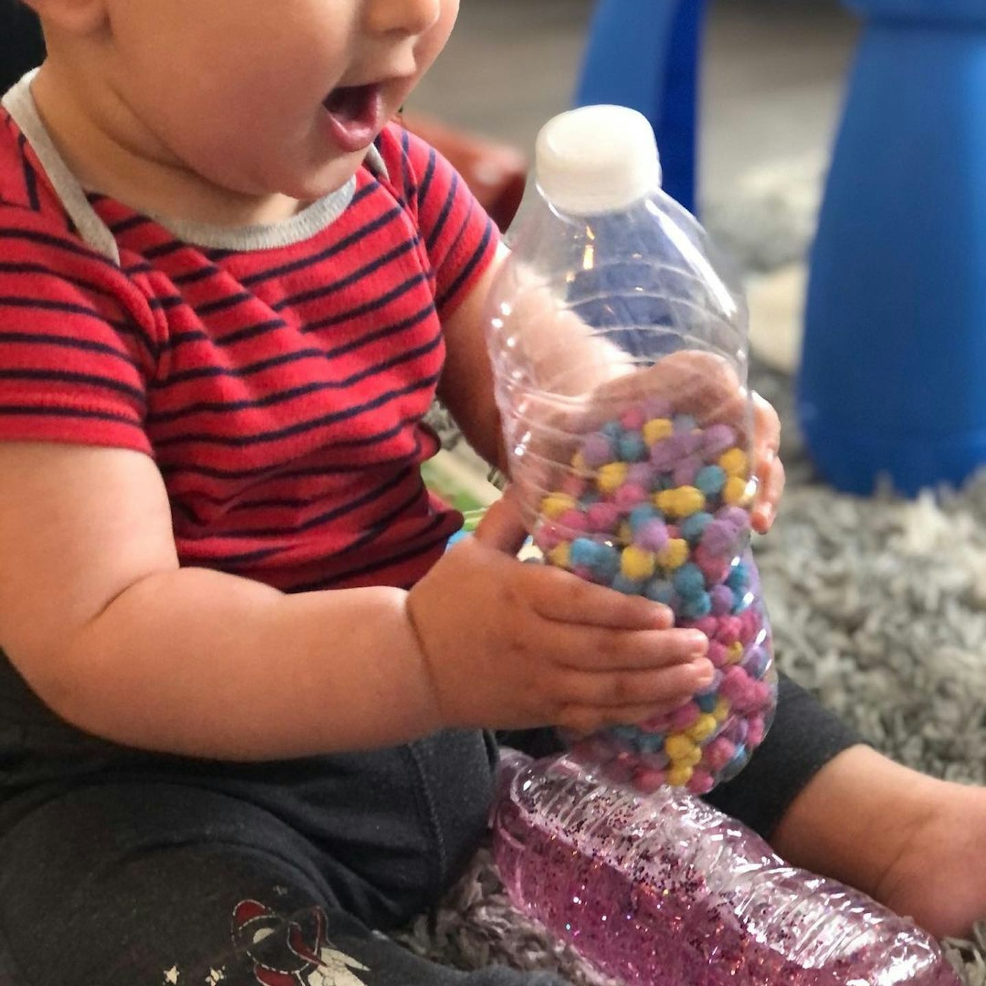 baby playing with DIY sensory bottle