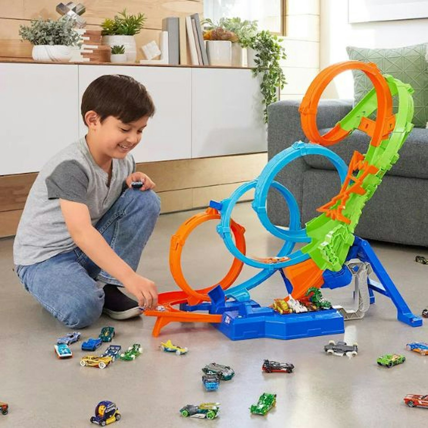 A young boy playing with the Hot Wheels
Action 4-Loop Crash Out track set