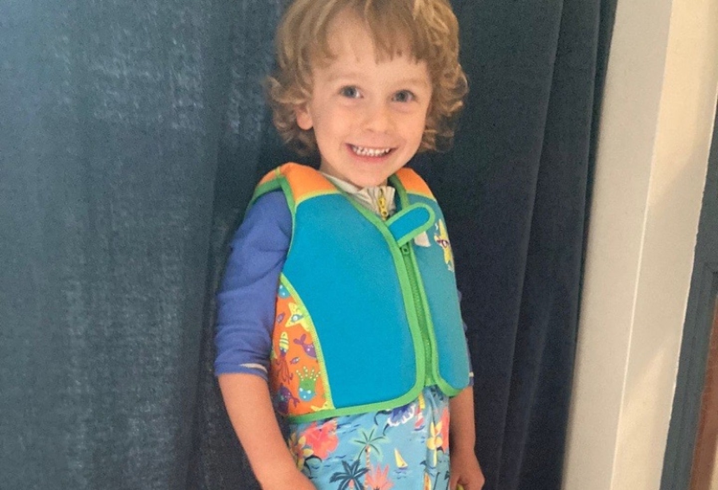 boy wearing the Zoggs Swim Jacket