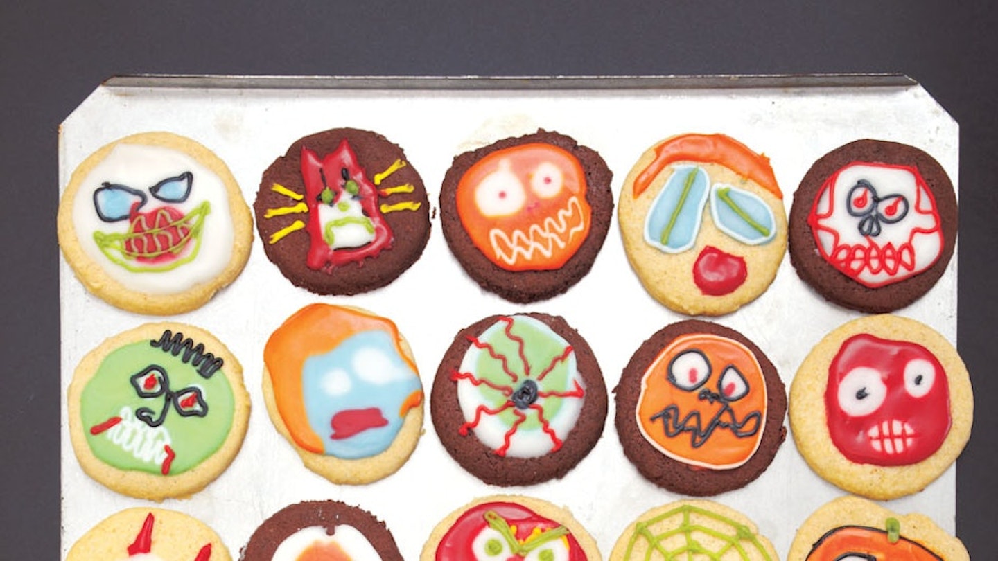 Halloween biscuits on a tray with lots of scary designs