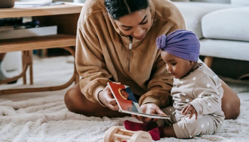 Mother and Baby Girl Reading a Book
