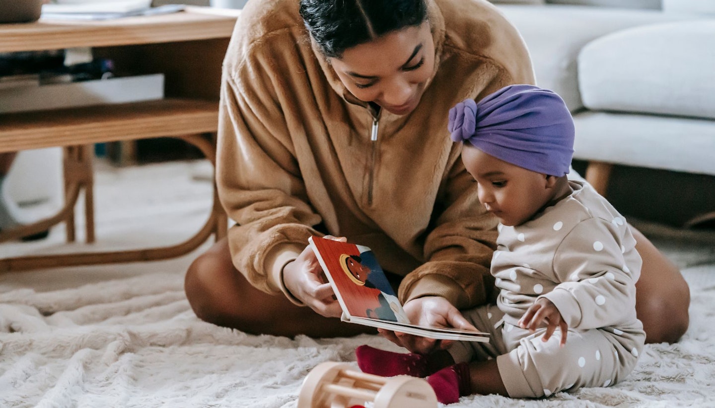 Mother and Baby Girl Reading a Book