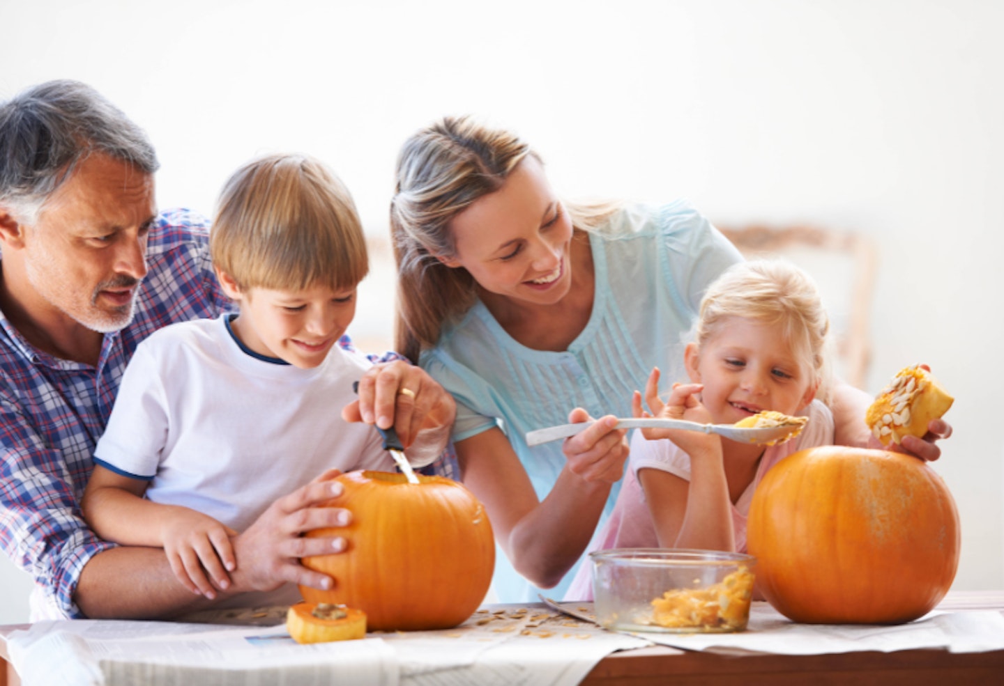 Family carving pumpkins