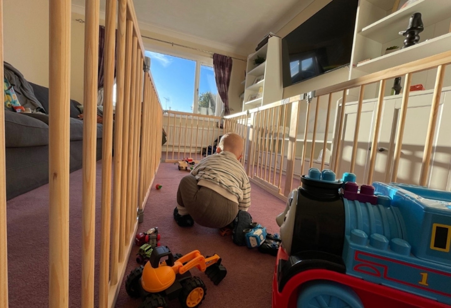 young child playing in the Baby Vivo Baby Playpen