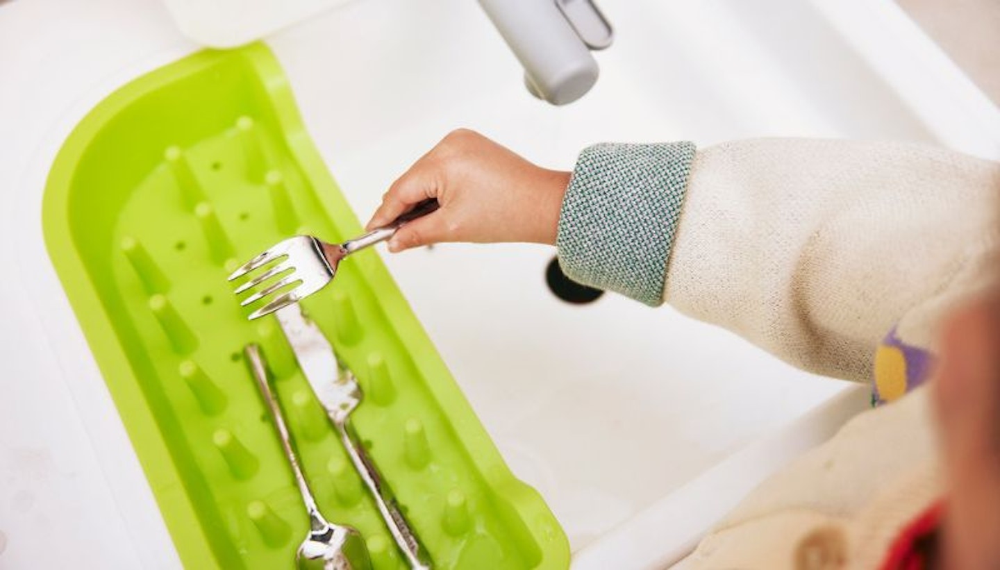 Image of the kitchen sink being used in the Real Life Play Kitchen Set