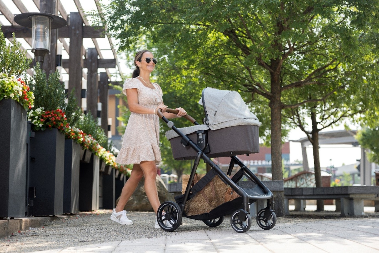 Mum pushing Graco pram