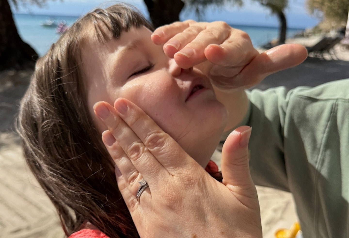 UltraSun Extreme SPF50+ Sun Cream being applied to young girl