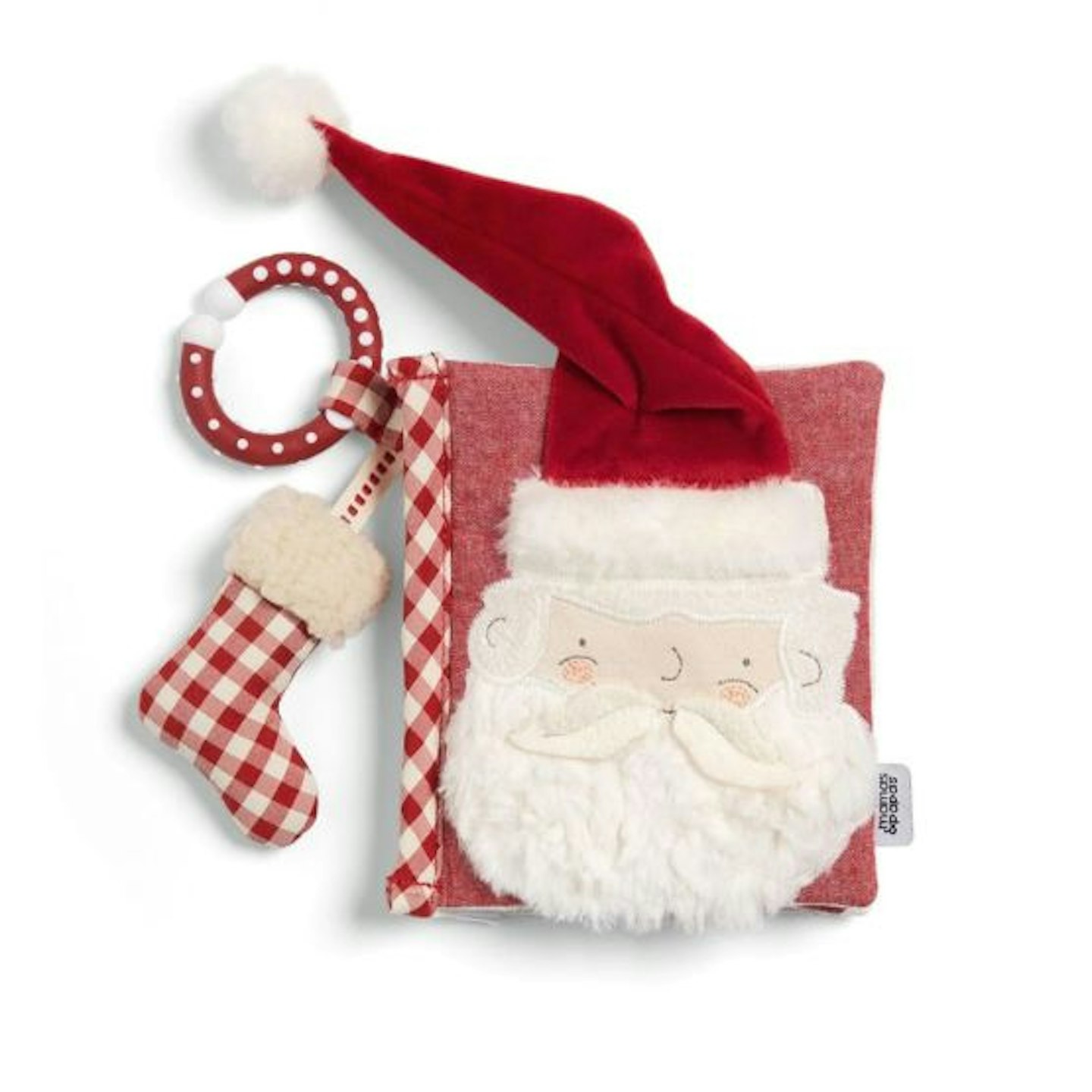 A baby book in soft fabric with a Father Christmas face and a little stocking