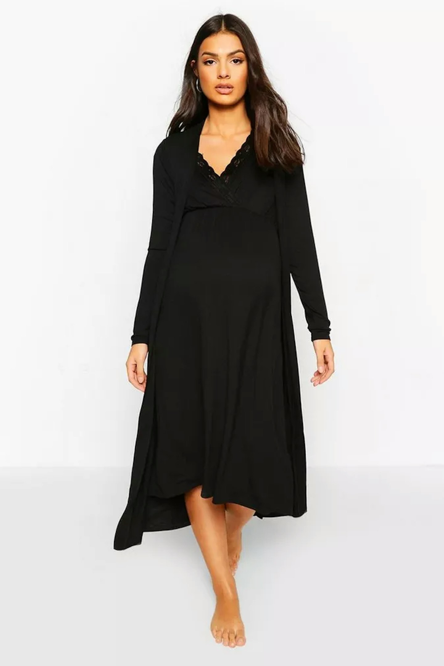 Pregnant woman in a black maternity nightie and robe set