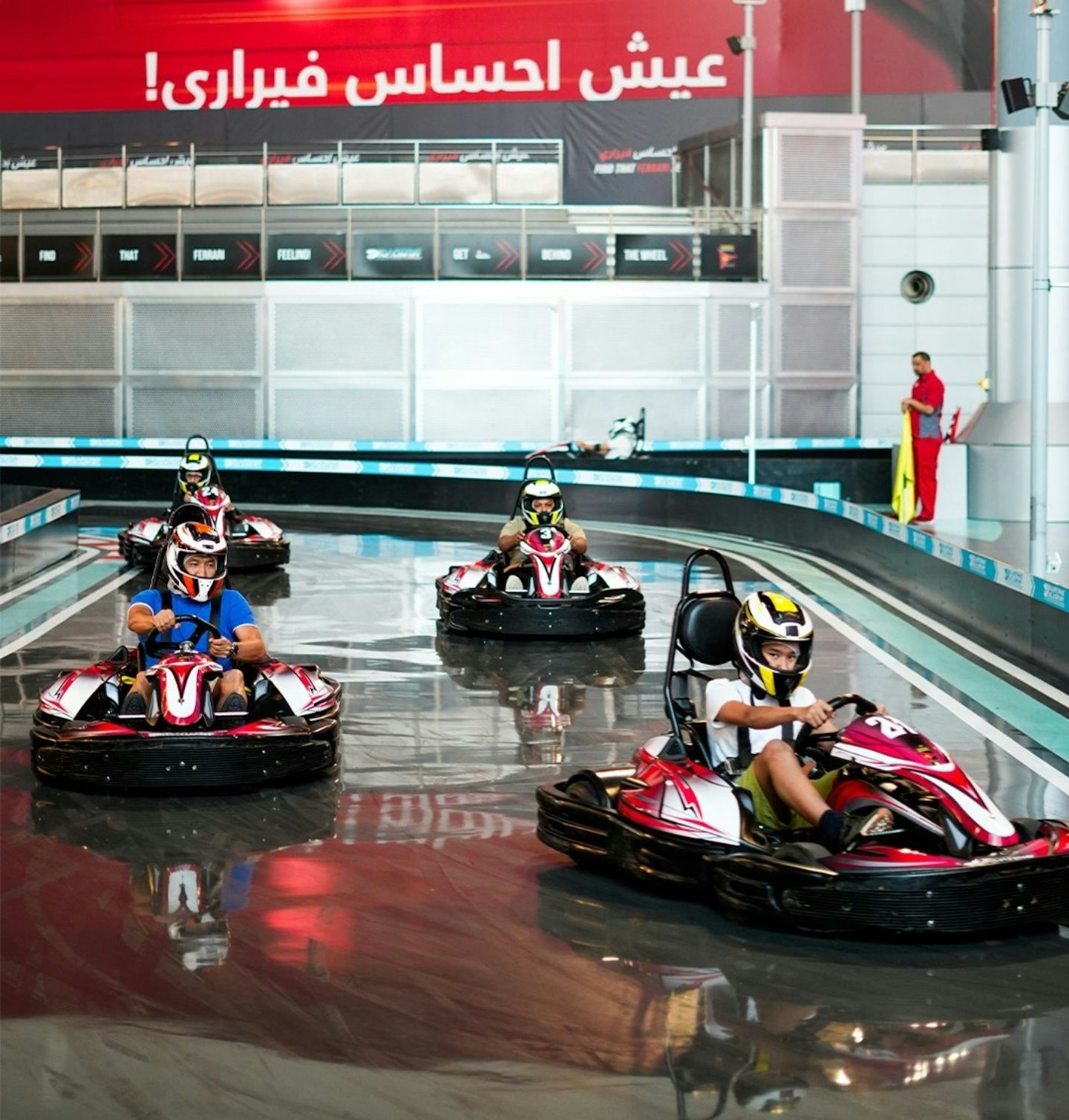 A family go-carting at Ferrari World Yas Island