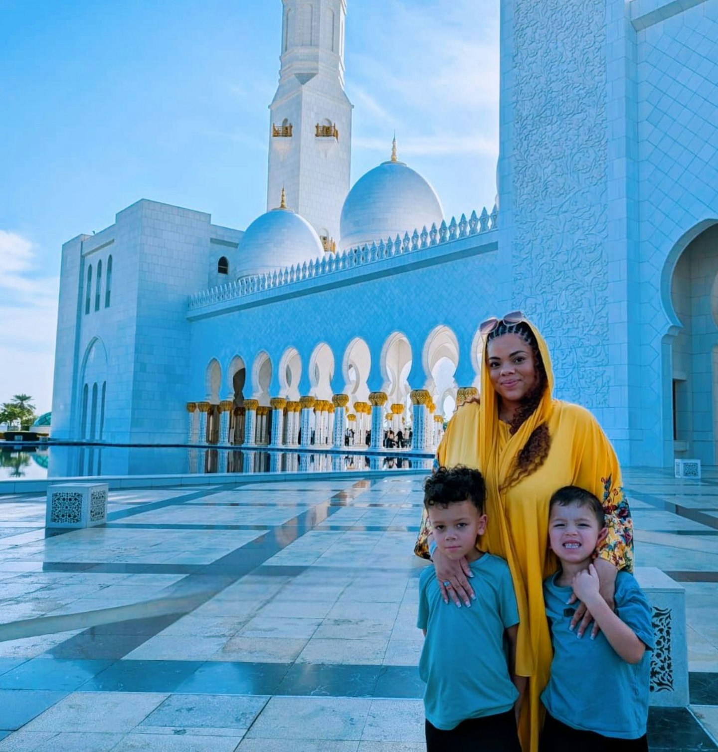 Senior writer Hannah Carroll with her two sons at Sheikh Zayed Grand Mosque.