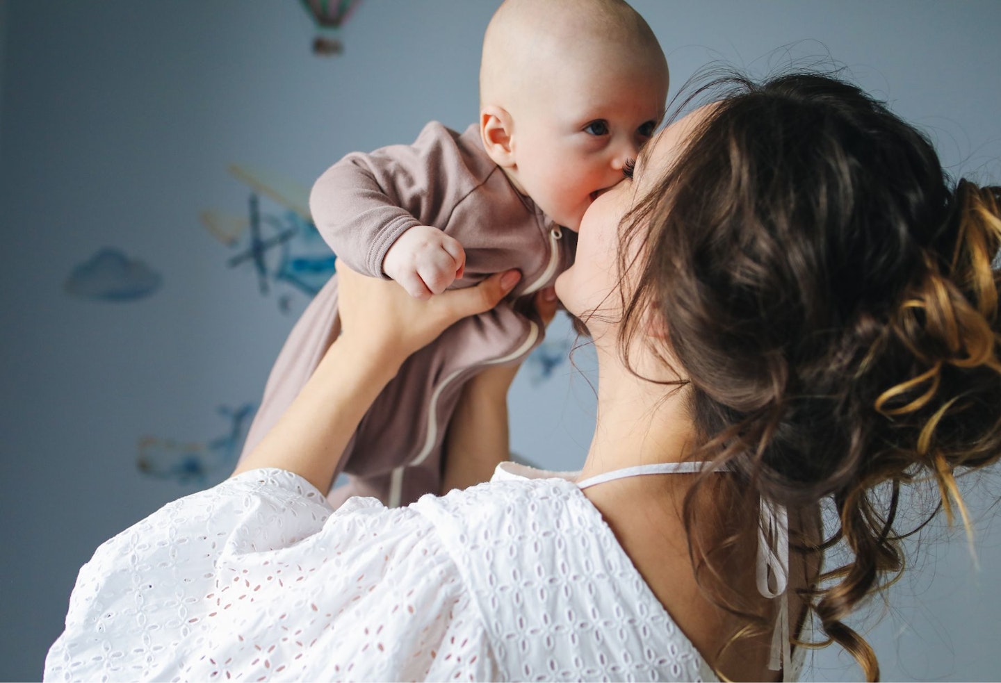 Mother Kissing Her Cute Baby