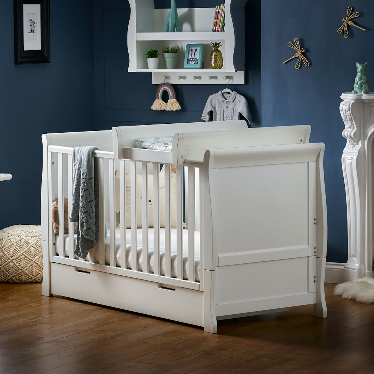 Obaby Stamford cot bed in nursery room with navy walls