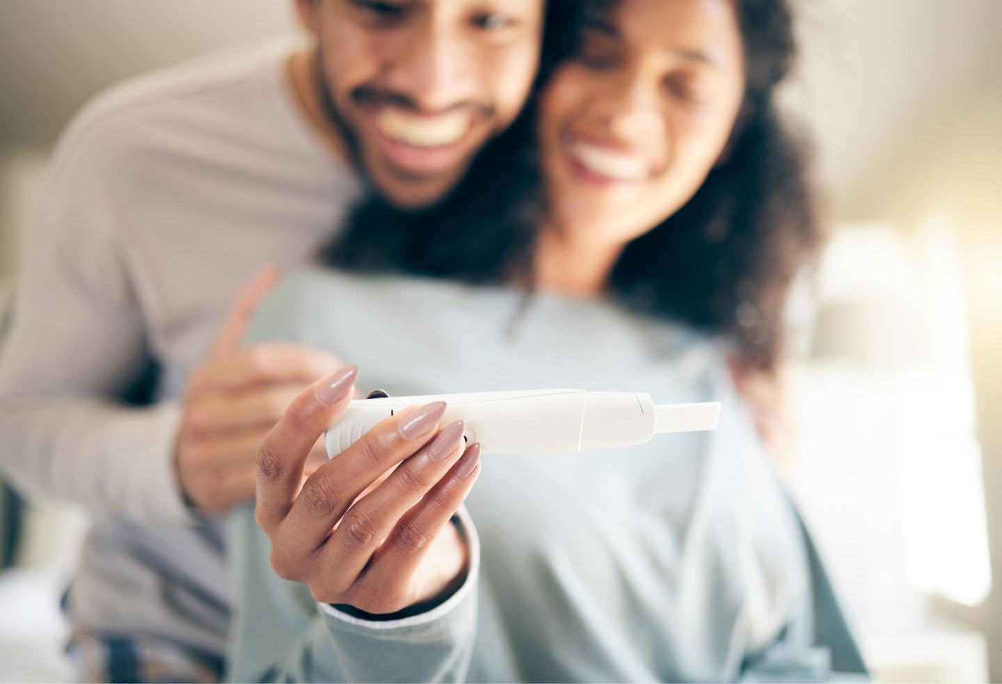 Pregnancy Test, Hands of Woman and Happy Couple, Smile and Baby Announcement Together in Home. Pregnant, Person and New Mother, Fertility and Support for Positive Results