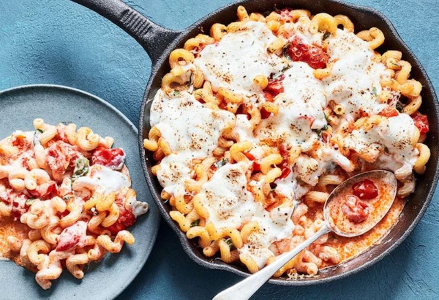 A pan filled with tomato and ricotta pasta