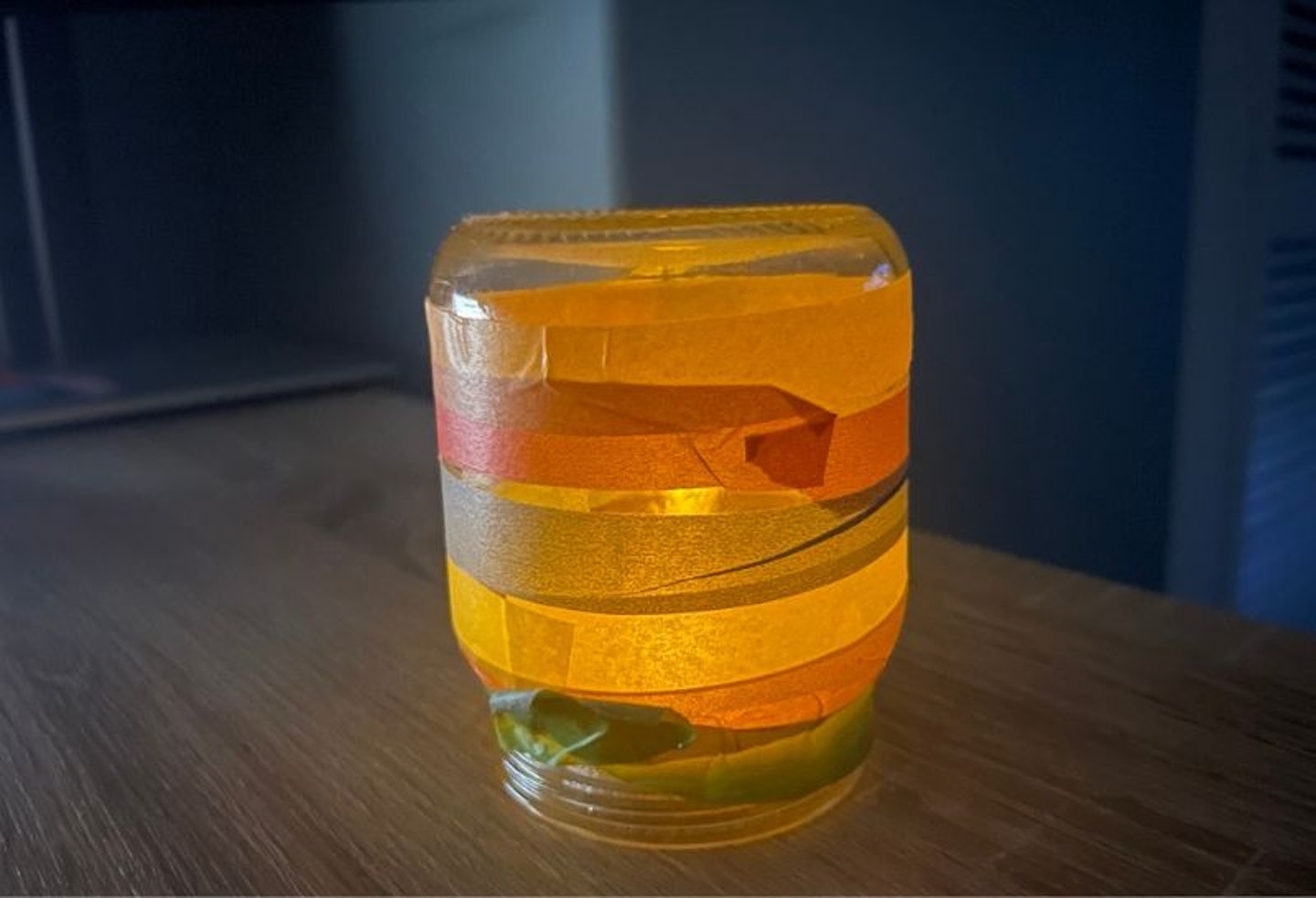 A Chinese lantern made out of a glass jam jar and tape