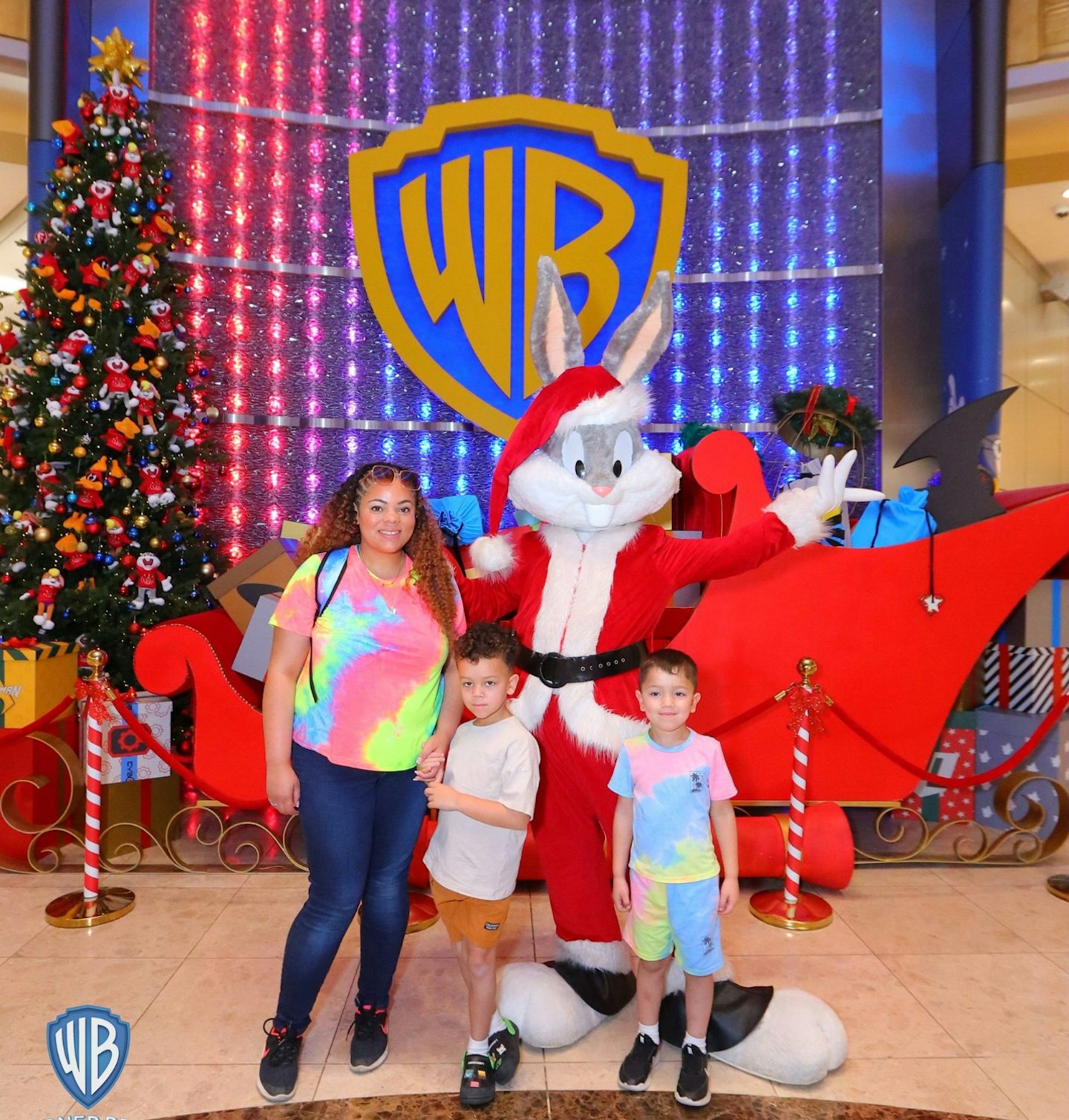 Hannah Carroll posing with her son's and Bugs Bunny atWarner Bros. World Abu Dhabi.