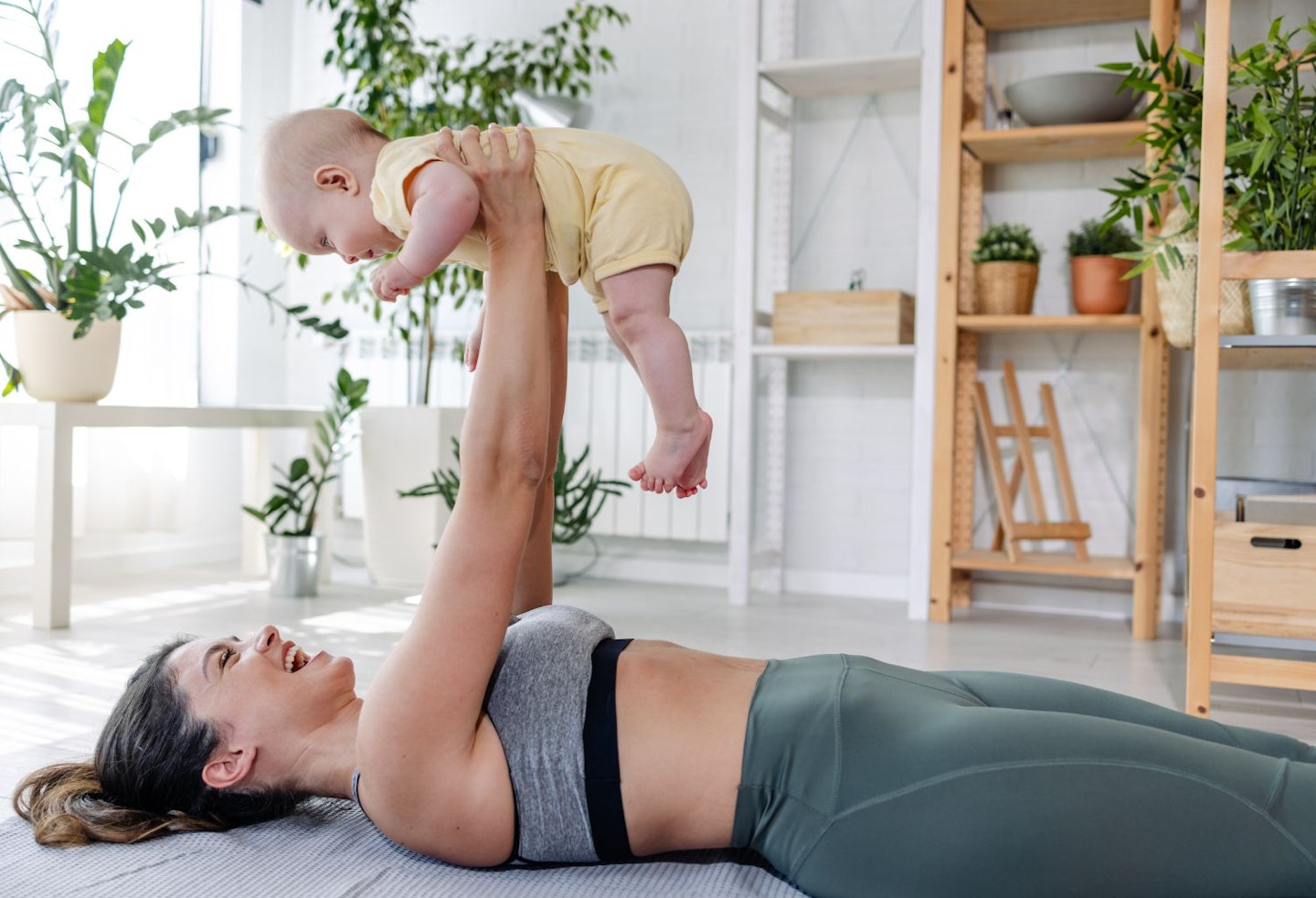 mum on yoga mat with baby