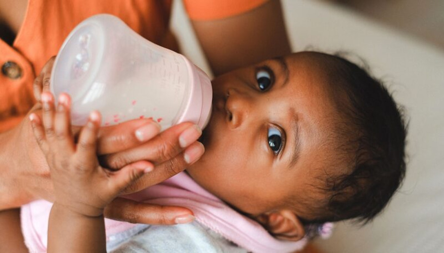 Baby Drinking Milk on Feeding Bottle