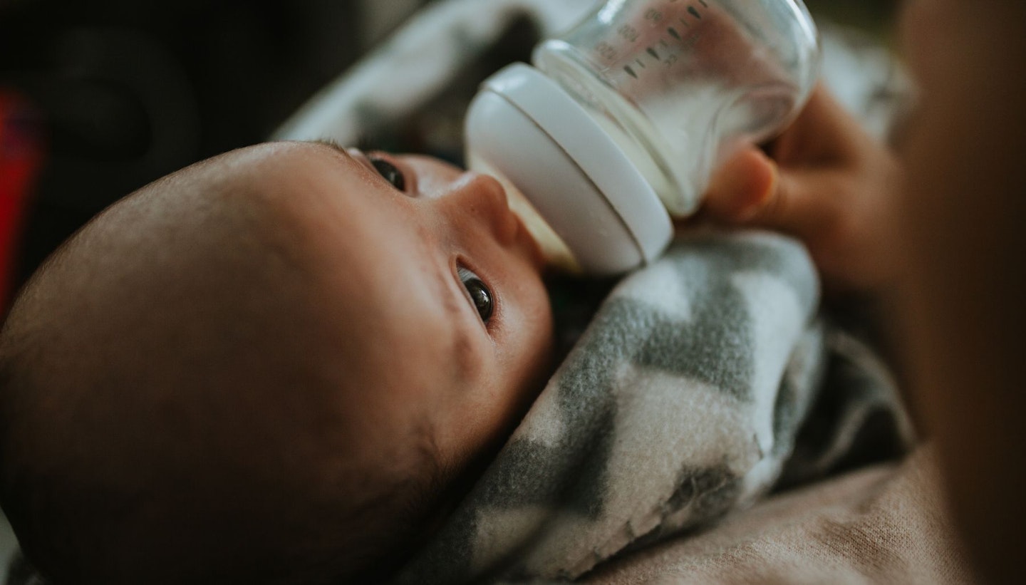 Close-Up Mother Feeding Baby Milk With Bottle