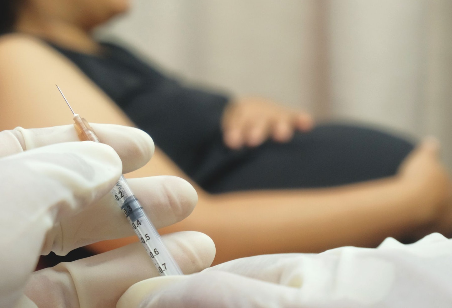 Doctor Injects Vaccine into Pregnant Woman