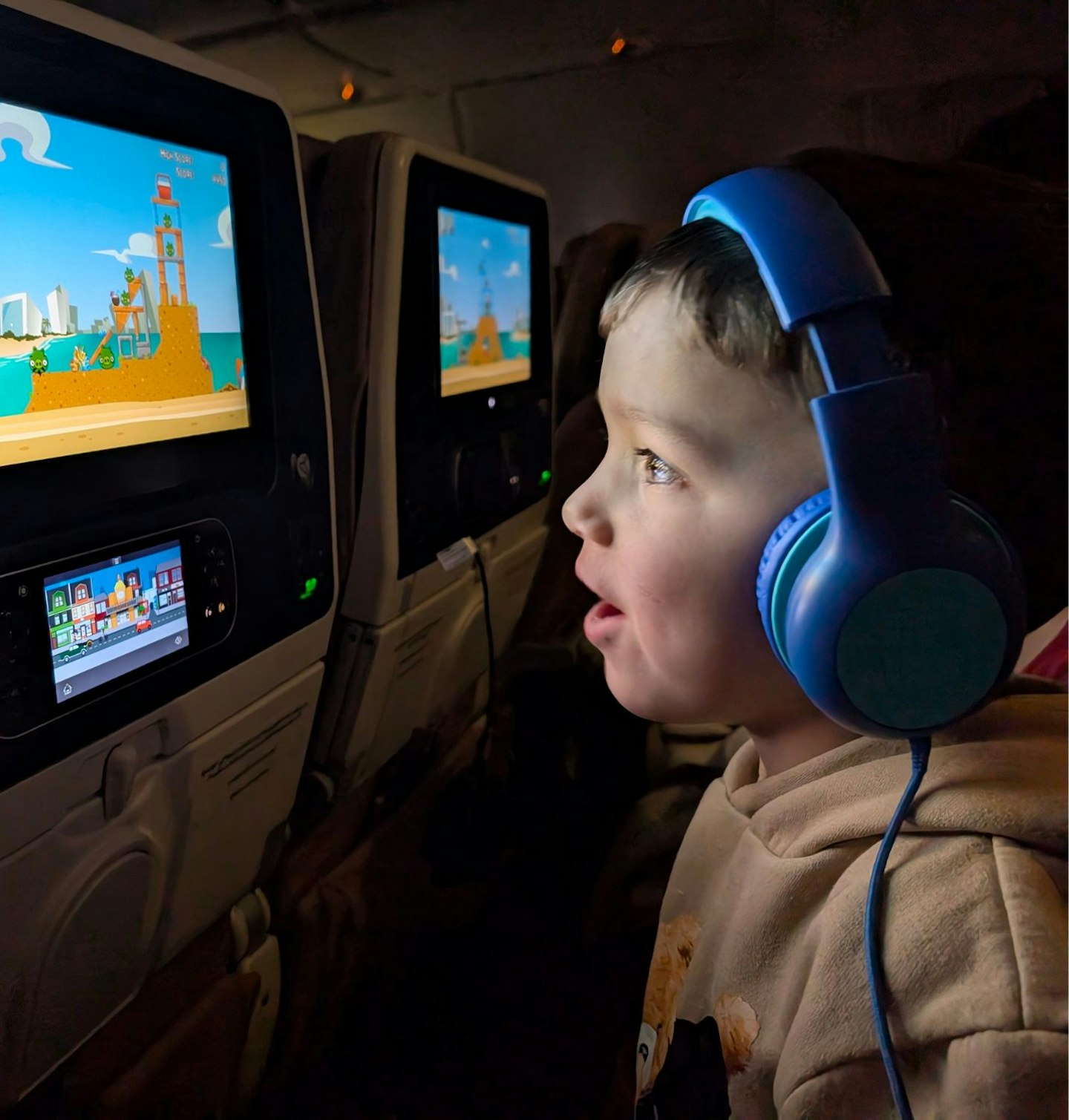 A little boy testing the Groov-e Kidz Wireless Bluetooth on a airplane flight.