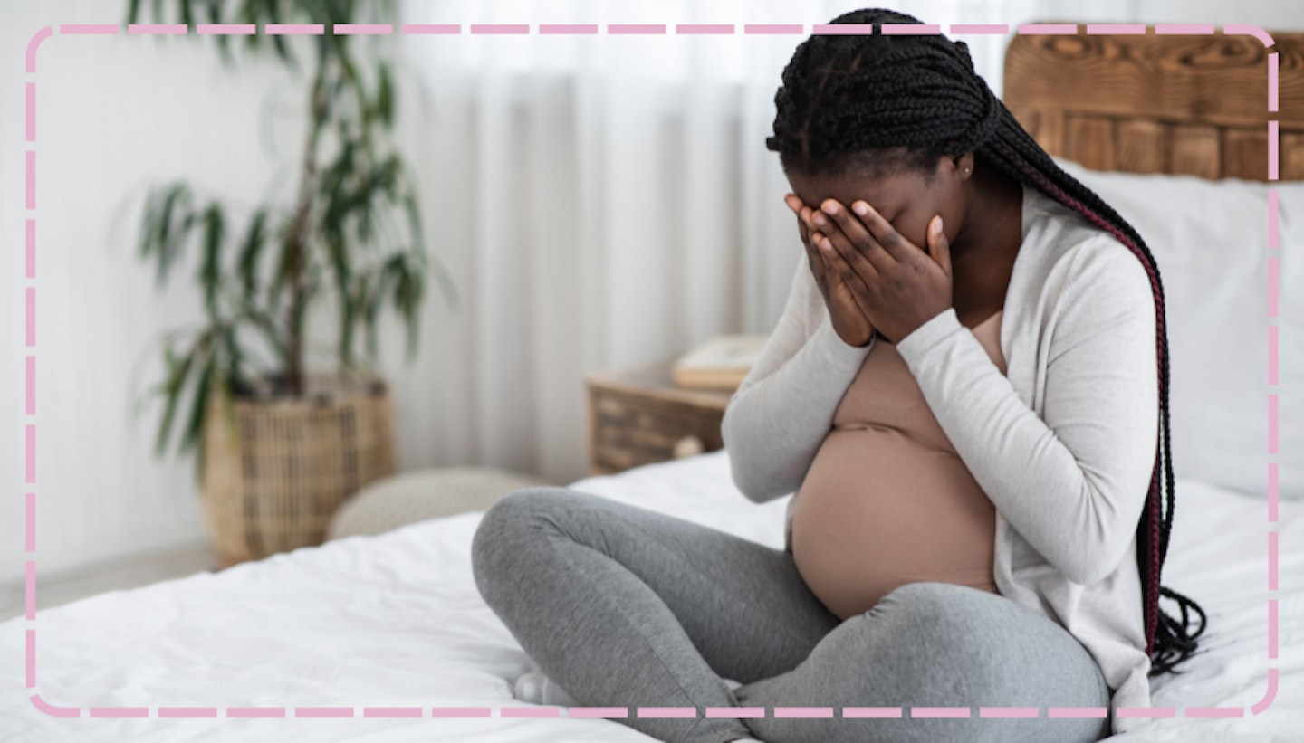 Mum with head in hands struggling with health anxiety