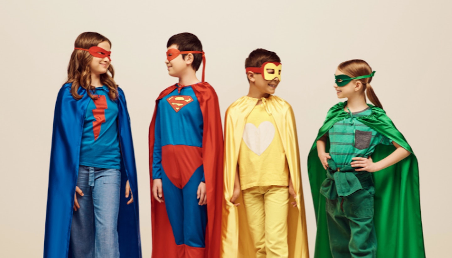 kids dressed up in superhero costumes