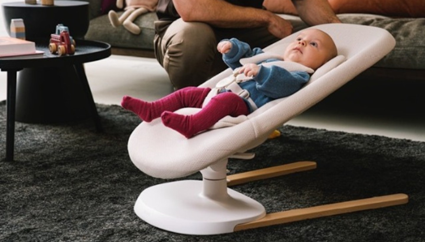 Baby sitting in the Stokke Yoga baby bouncer