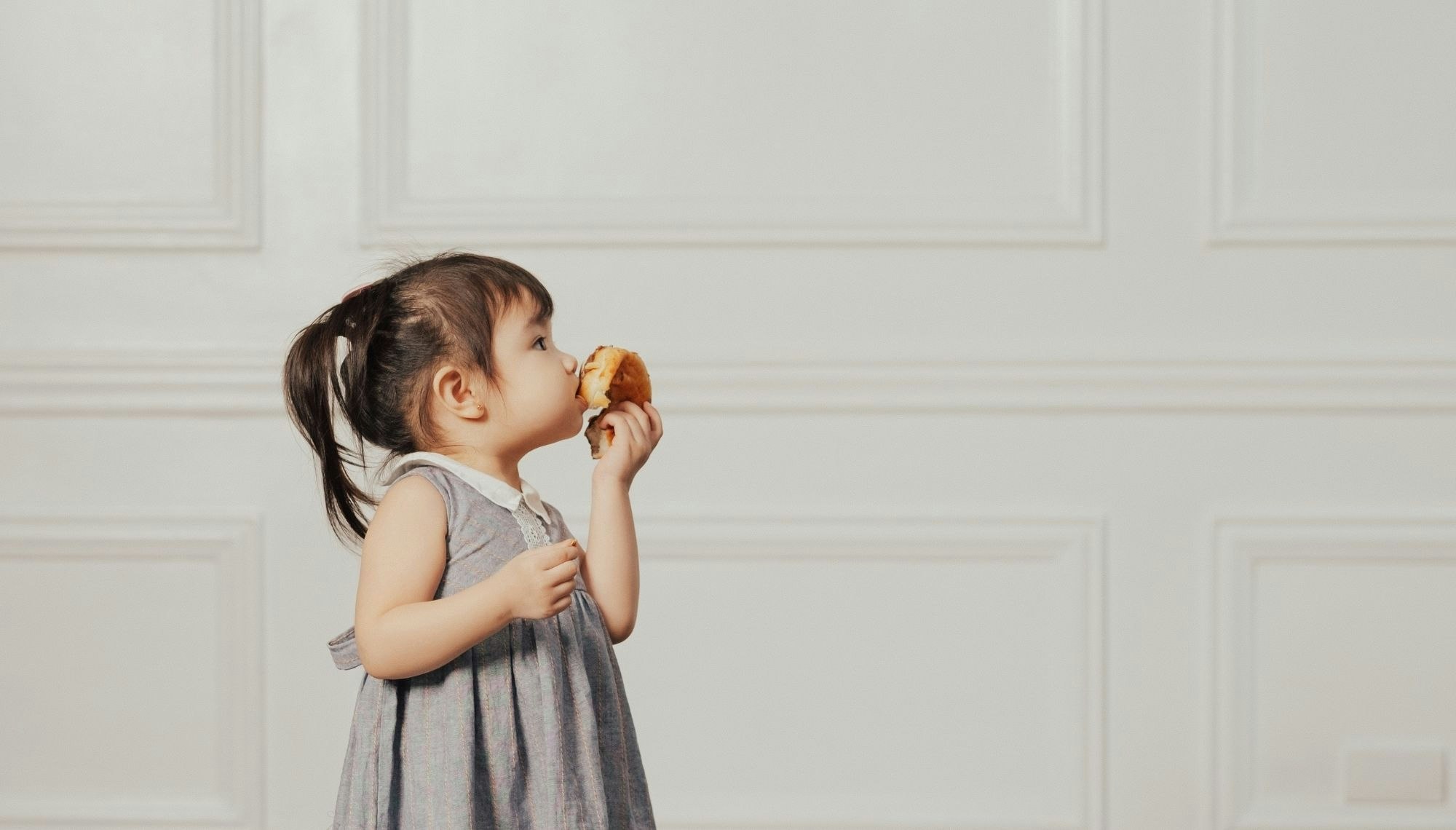 Little Girl Eating Donut