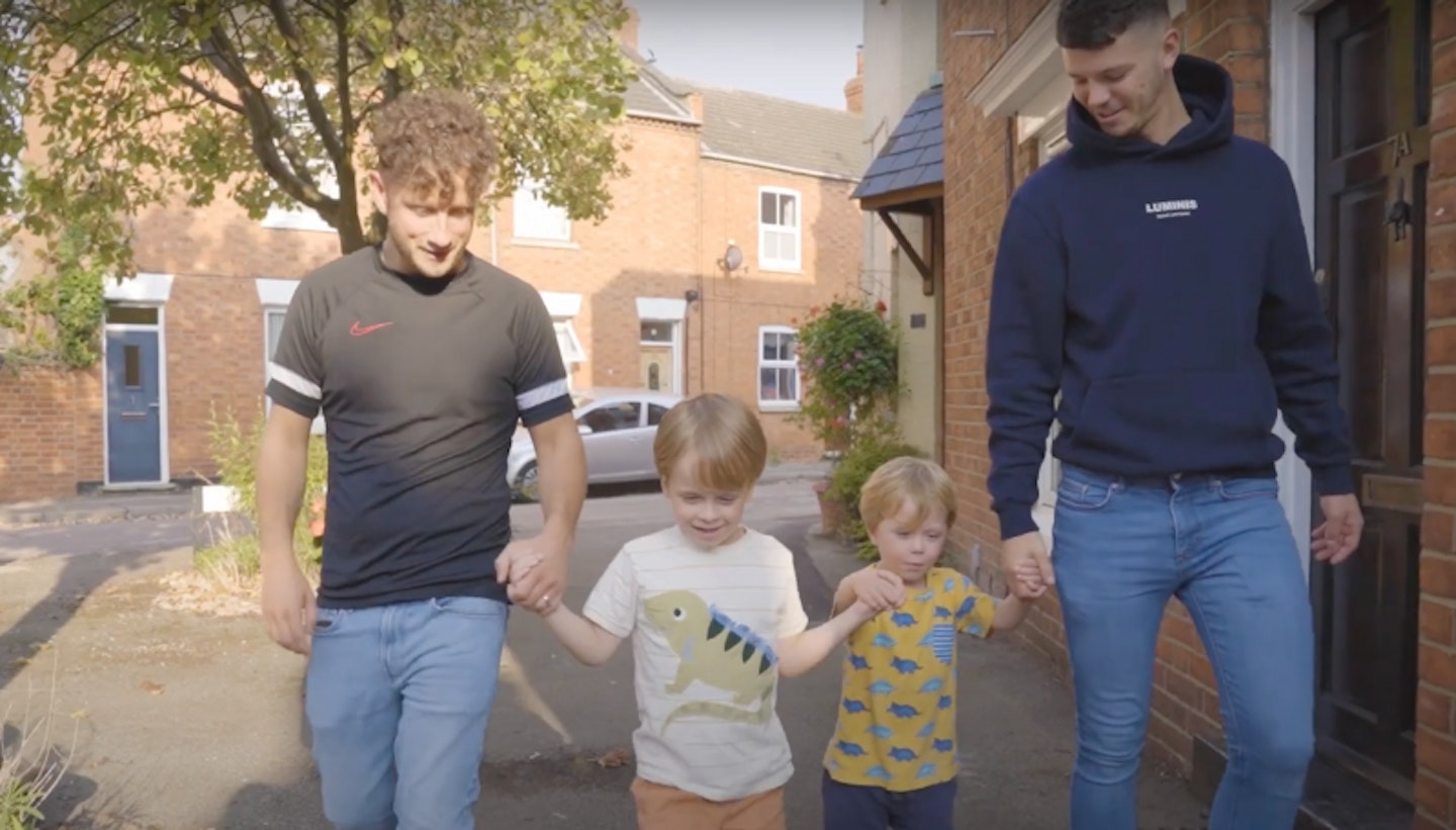 Brandon and Adam walking with two foster children