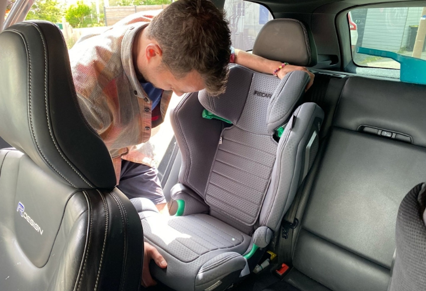 RECARO Axion 1 being installed in the car