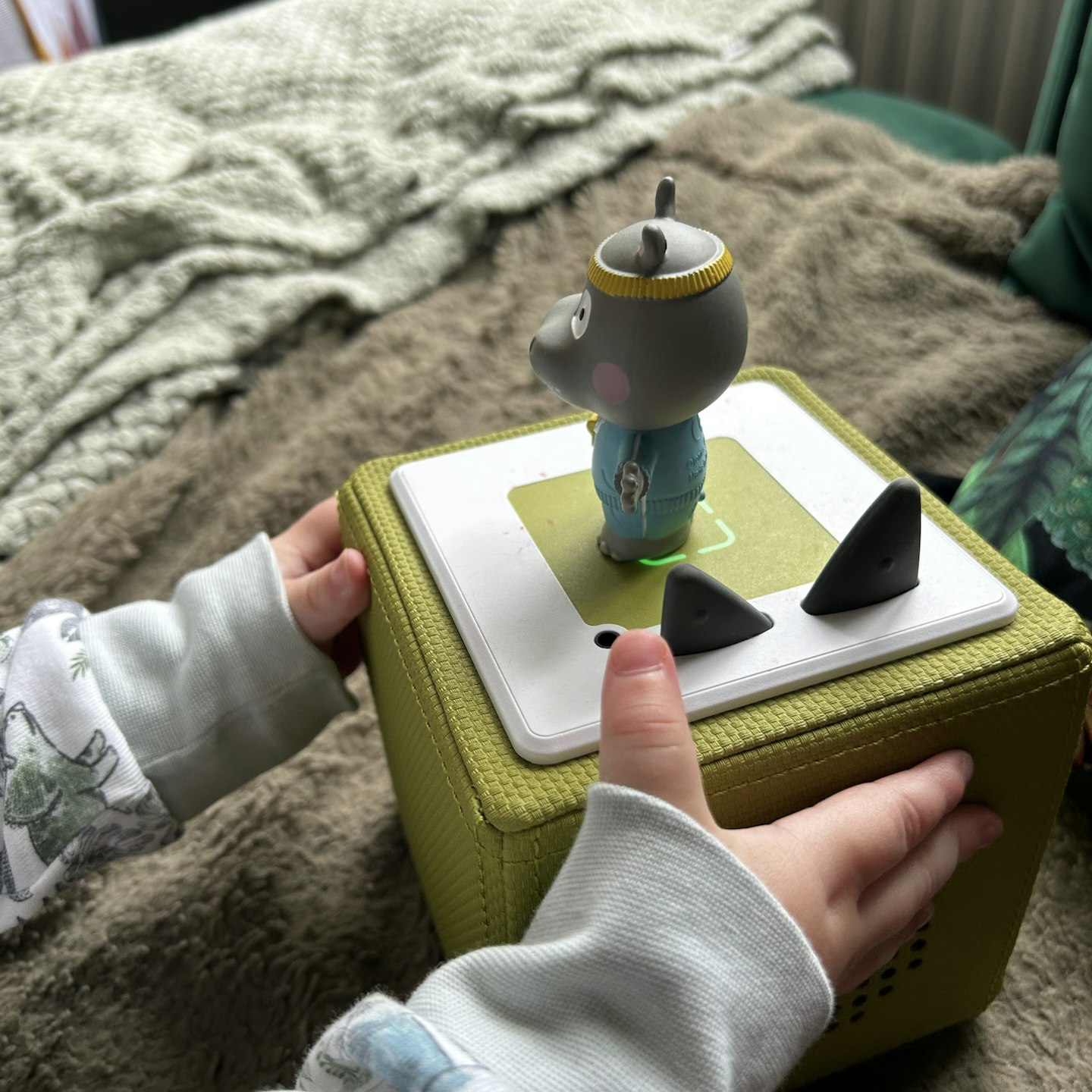 two year old playing with Toniebox
