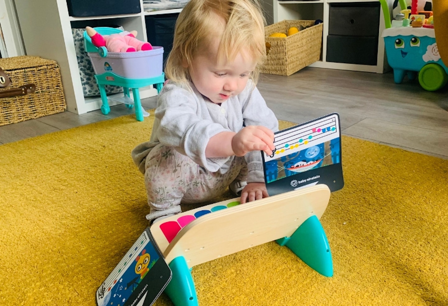 the Baby Einstein Hape Magic Touch Piano being used by a toddler