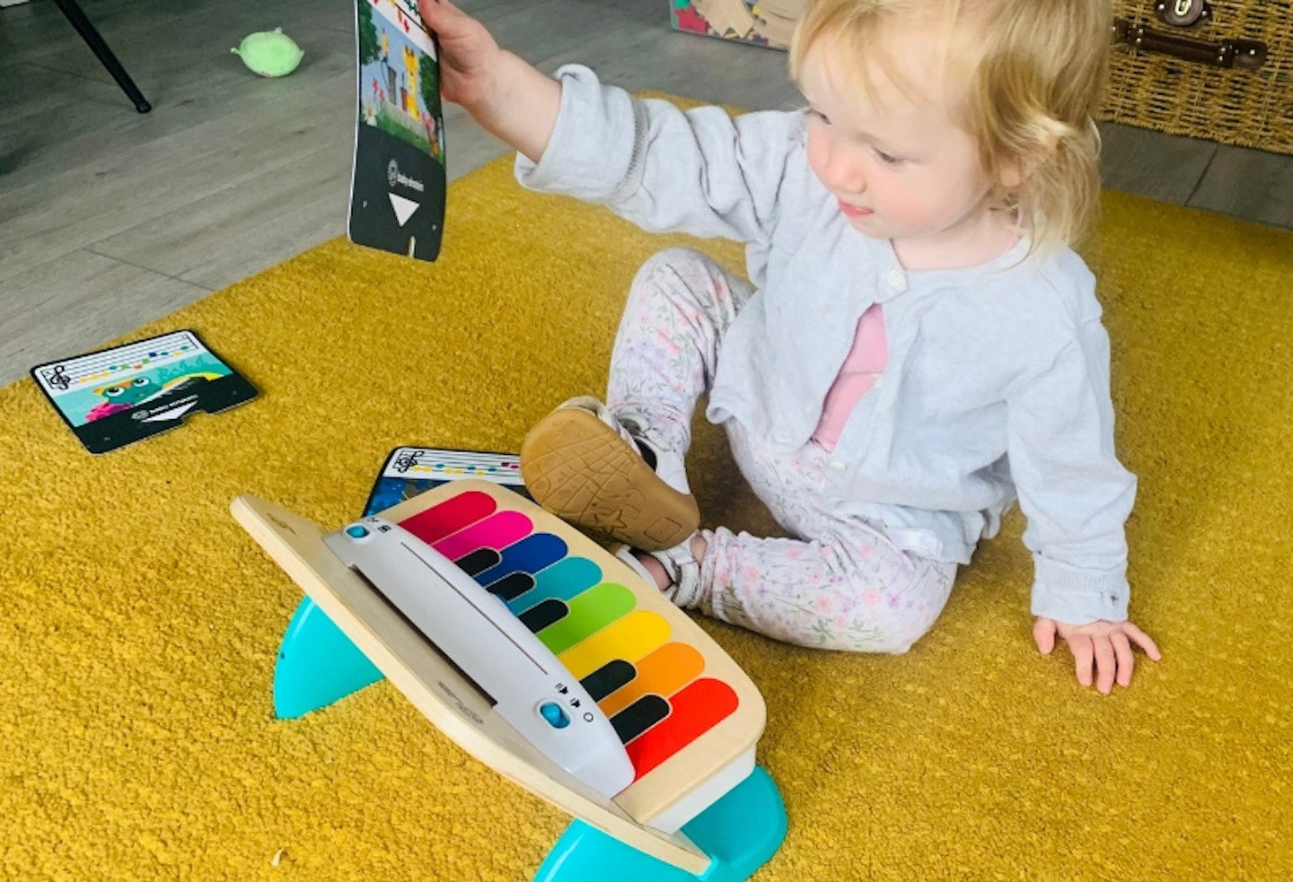 the Baby Einstein Hape Magic Touch Piano being used by a toddler