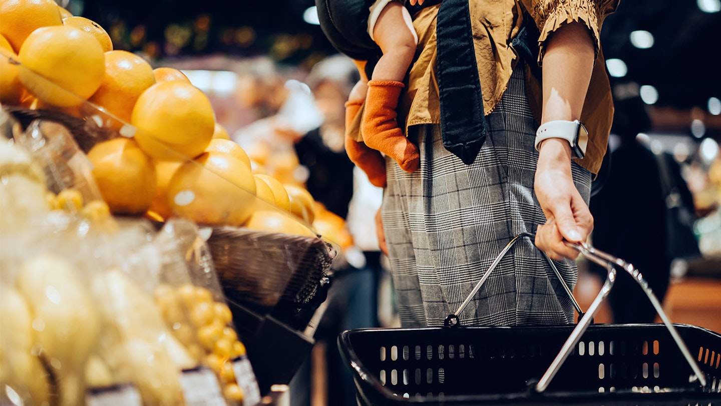 mother holding a shopping basket