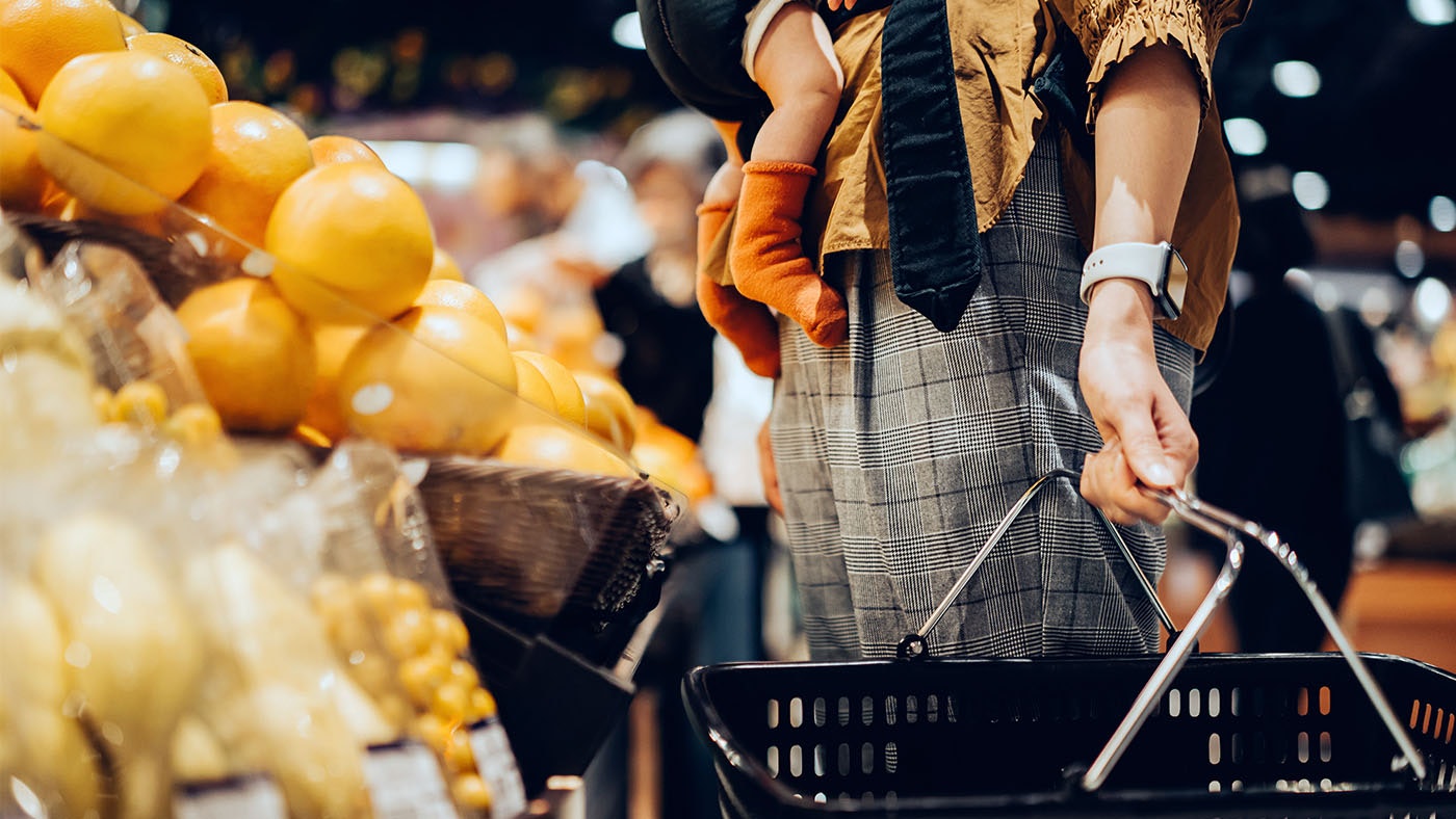 mother holding a shopping basket