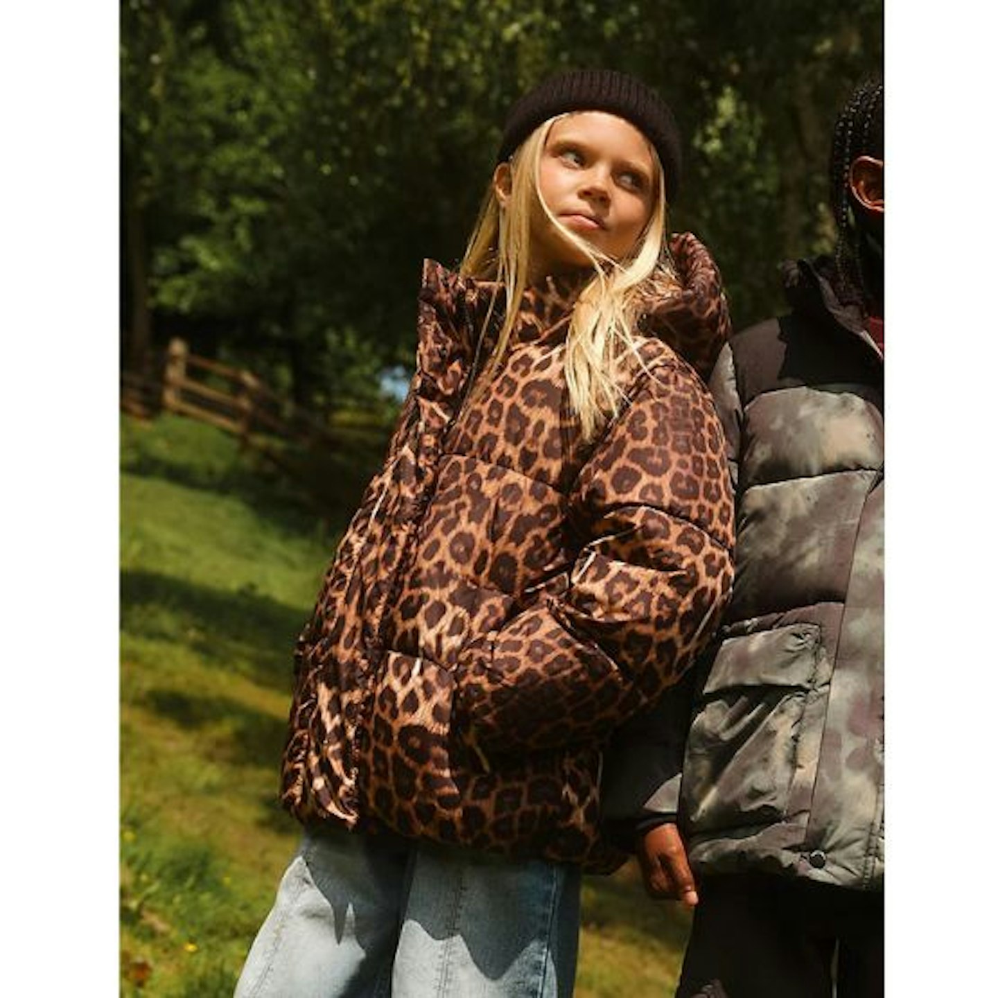 A young girl in Asda George leopard print coat