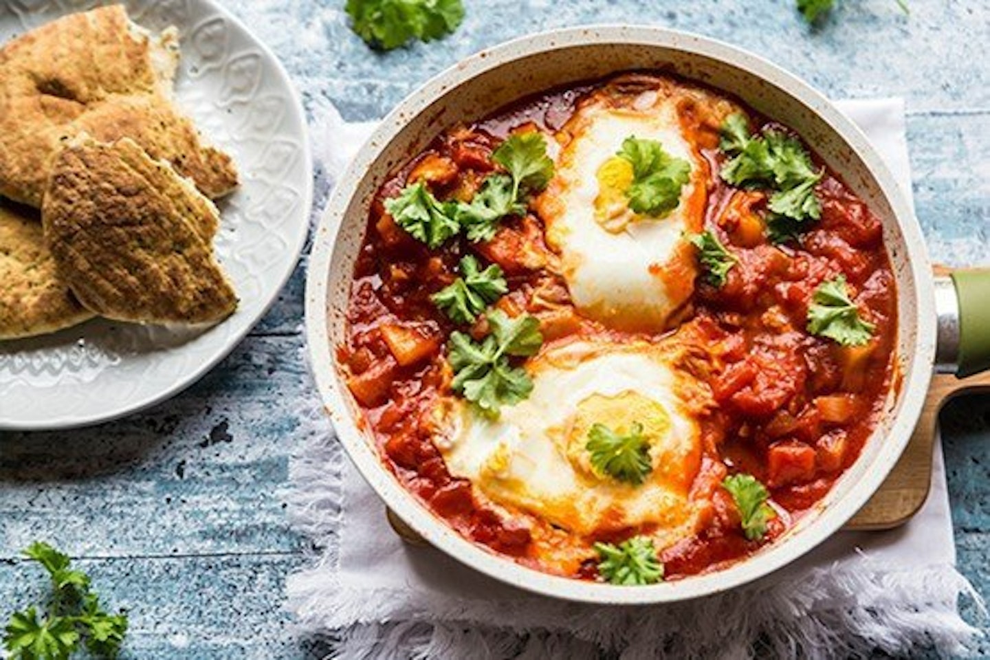 Baked eggs with tomatoes and chilli