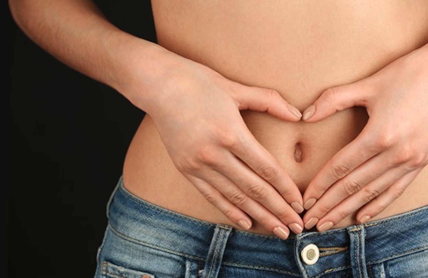 woman holding stomach