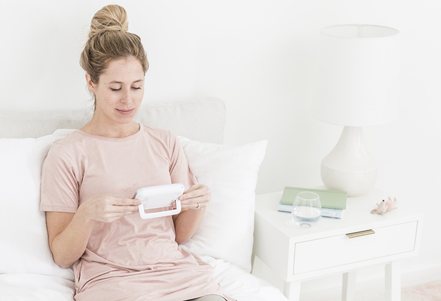 Woman watching a baby monitor