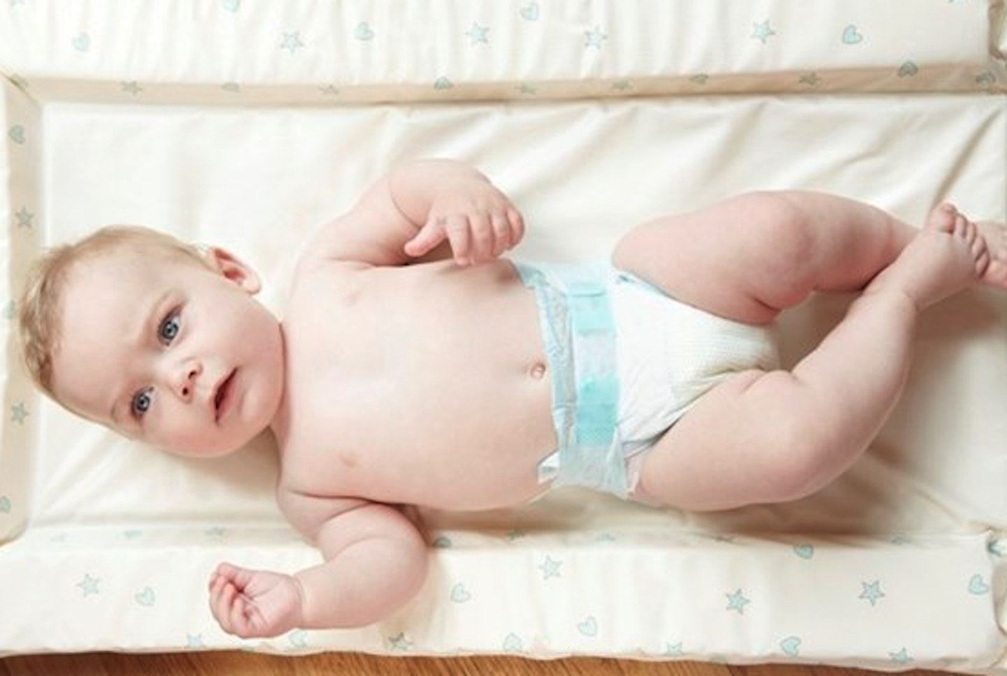 baby on changing table