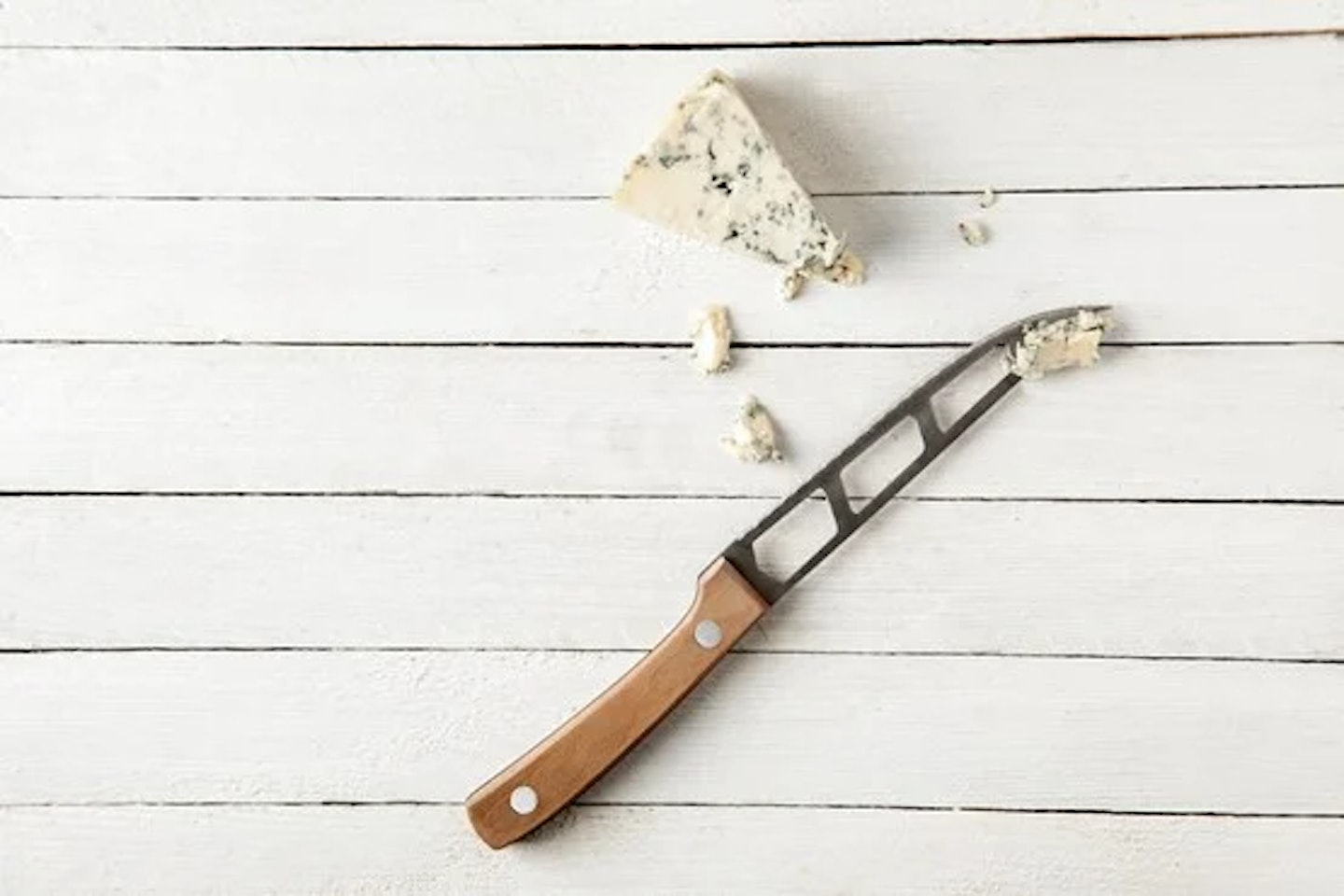 Stilton on a table with a knife