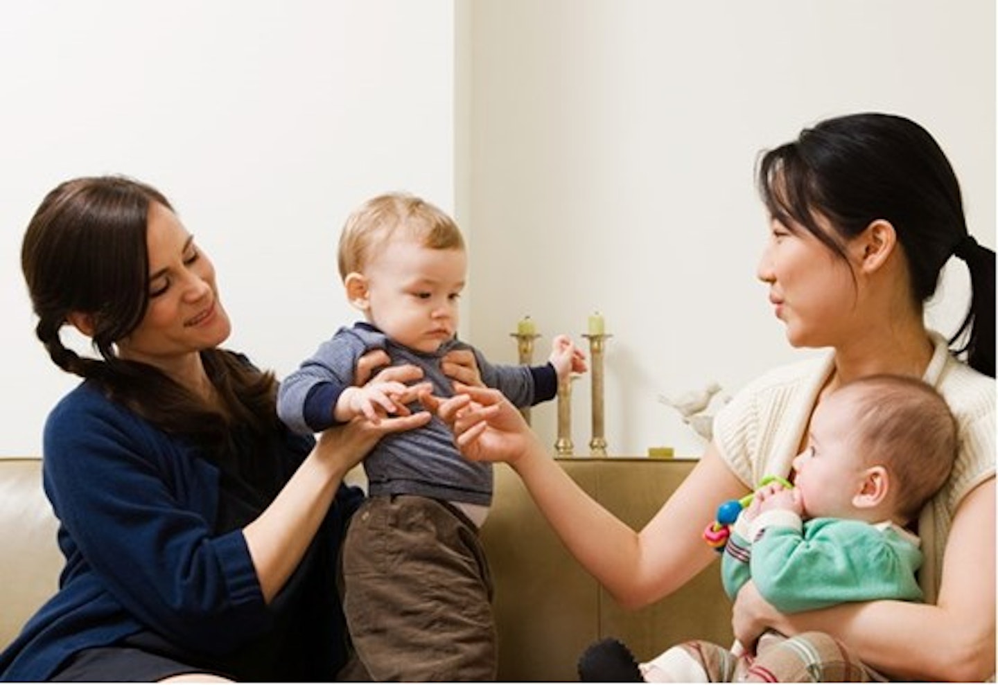 two mums and two toddlers playing