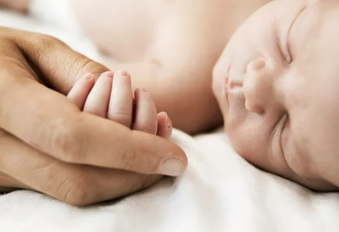 mother holding baby