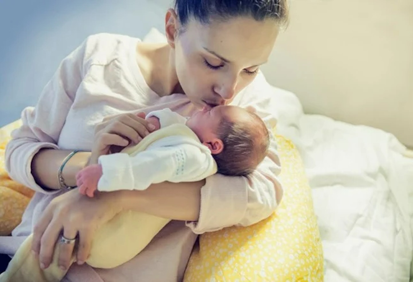 mother cradling baby